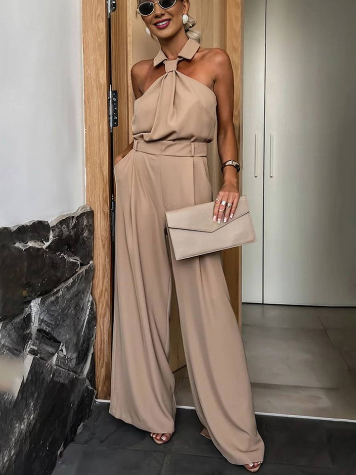 Combinaison ample femme fluide noire, col chemise sans manches. Tenue chic décontractée, confort mode féminine été.