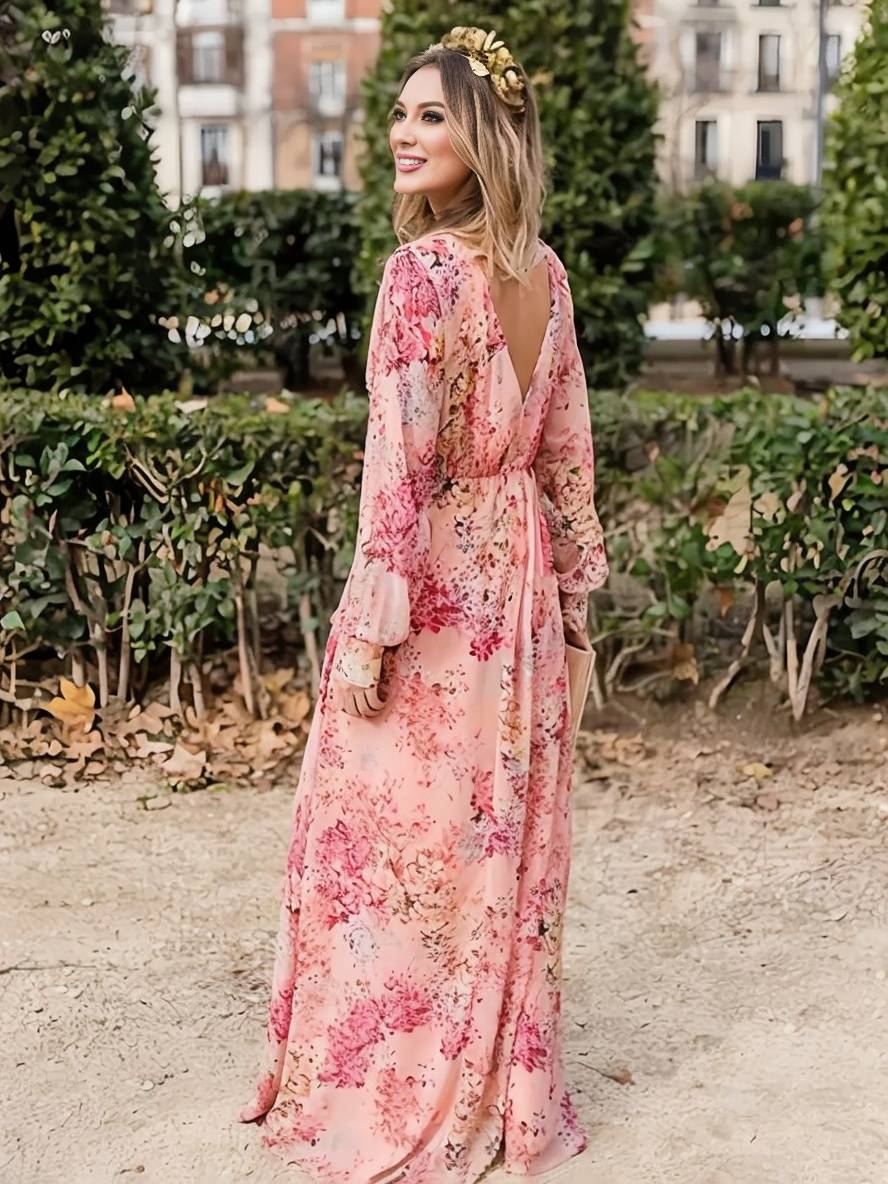 Robe longue femme sans manches, col V. Motif floral délicat, coupe fluide pour un look printemps-été chic.