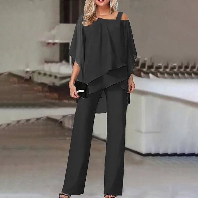 Ensemble moderne femme deux pièces fluide, haut et pantalon. Tenue élégante et confortable, idéale pour soirée.