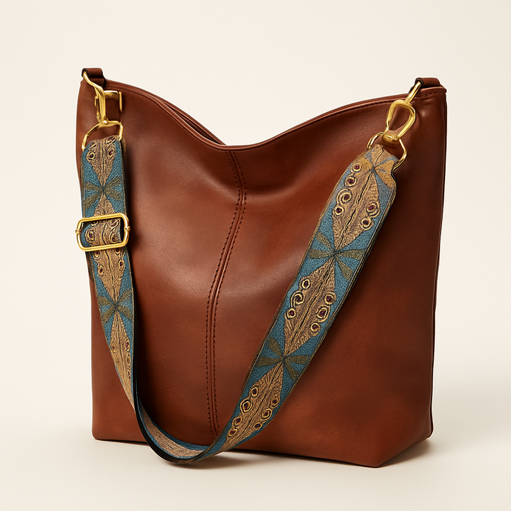 Sac à main seau femme en cuir vegan, détails de bandoulière brodée. Idéal pour un look bohème chic et tendance.