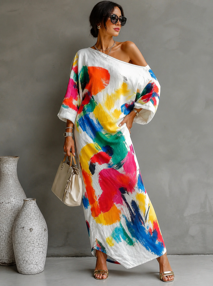 Élégante robe maxi asymétrique pour femme, coupe unique à l'épaule, motif artistique. Idéale pour l'été.