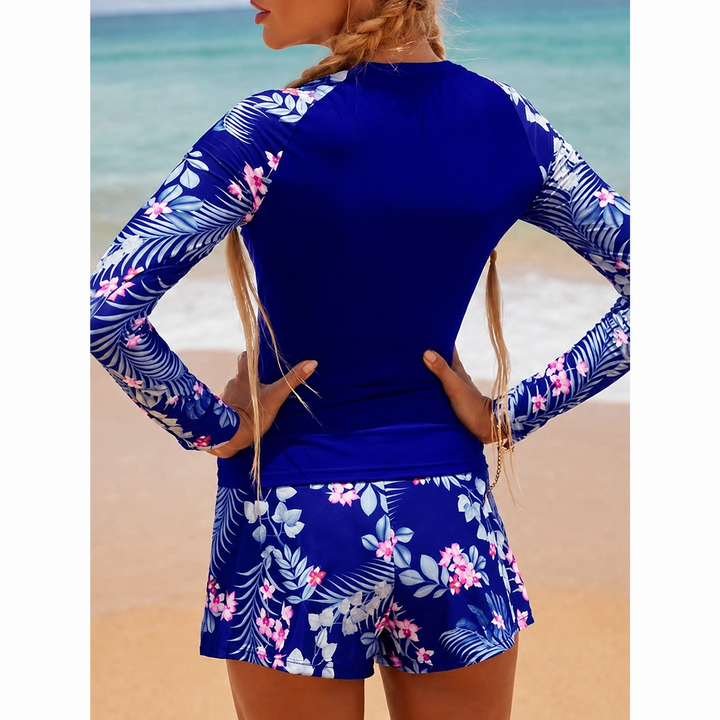 Vêtement de plage femme deux pièces noir, manches longues, élégance aquatique et protection UV.