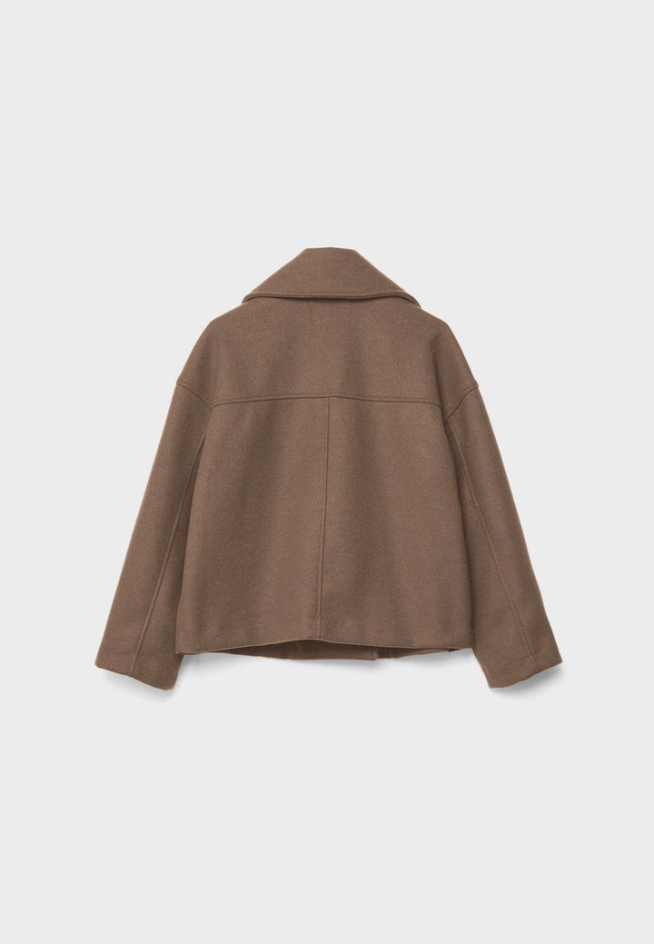 Peacoat femme, double boutonnage, chic et élégant, parfait pour le printemps ou l'automne.