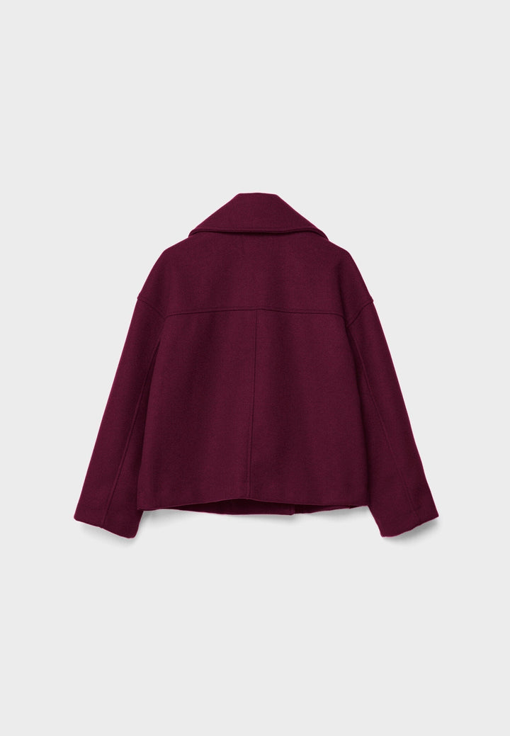 Veste courte femme, design chic, double boutonnage, mode féminine contemporaine.