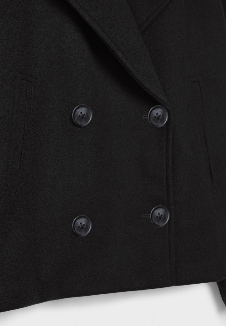 Blazer femme chic et courte, double boutonnage, mode féminine, pour un style raffiné.