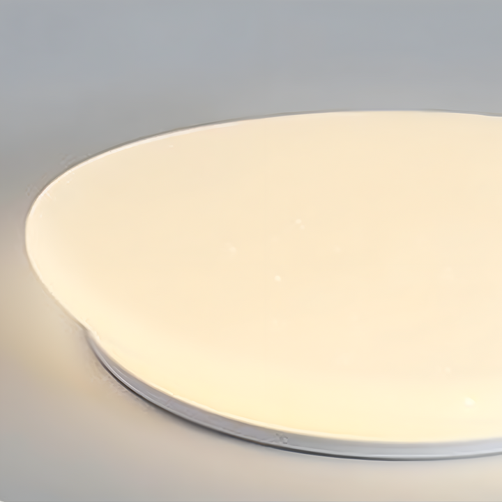 Plafonnier LED Peblira, design galet unique. Éclairage économe en énergie pour une ambiance sereine et moderne.
