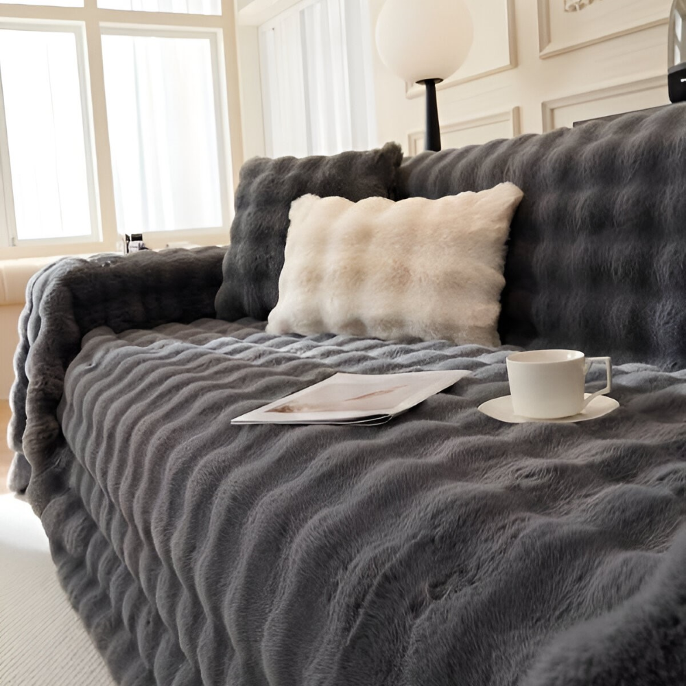 Couverture polaire ultra douce pour canapé, idéale pour un confort cocooning à la maison.