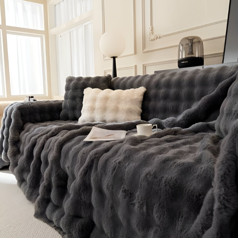 Jeté de canapé en polaire épaisse, parfait pour la décoration du salon et les soirées douces.
