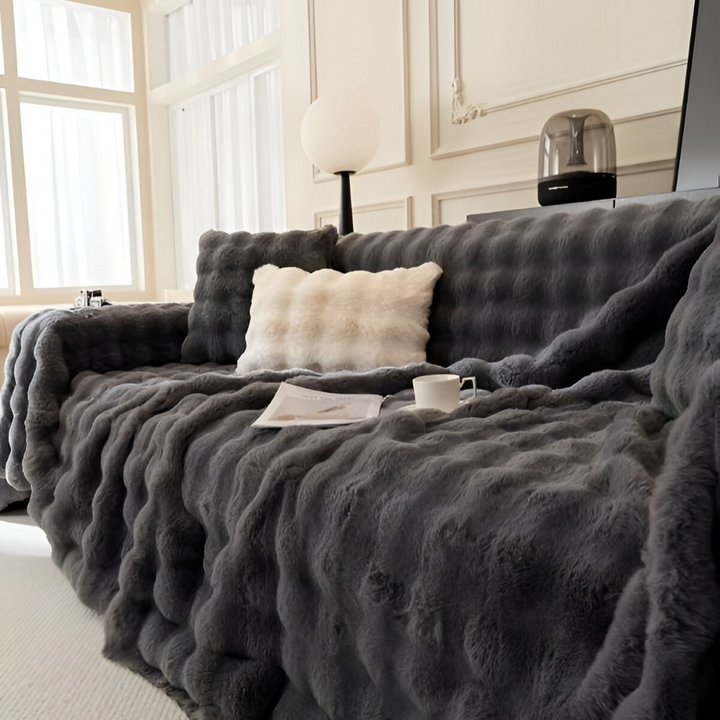 Jeté de canapé en polaire épaisse, parfait pour la décoration du salon et les soirées douces.
