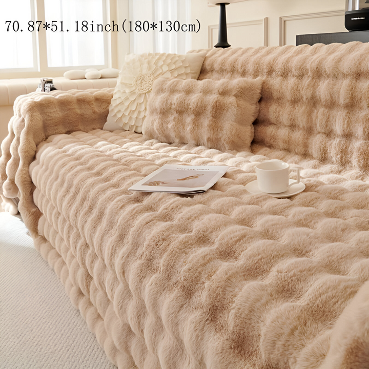 Couverture épaisse en polaire pour des soirées cosy, ajoutant une touche chaleureuse à la maison.