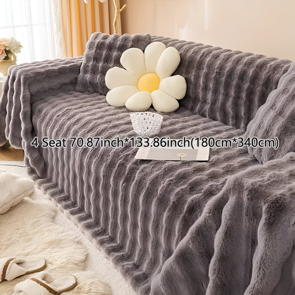 Plaid de maison en polaire, conçu pour le confort, la douceur et une décoration élégante du salon.