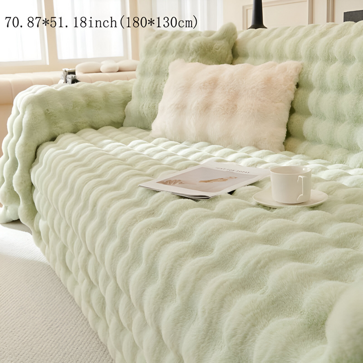 Couverture de salon en polaire, douce, chaude et parfaite pour une décoration cosy et accueillante.