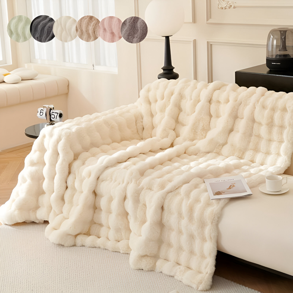 Plaid polaire élégant pour canapé, combinant chaleur, douceur et décoration moderne du salon.