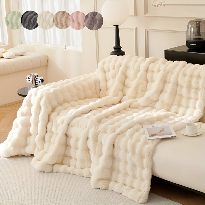 Plaid polaire élégant pour canapé, combinant chaleur, douceur et décoration moderne du salon.