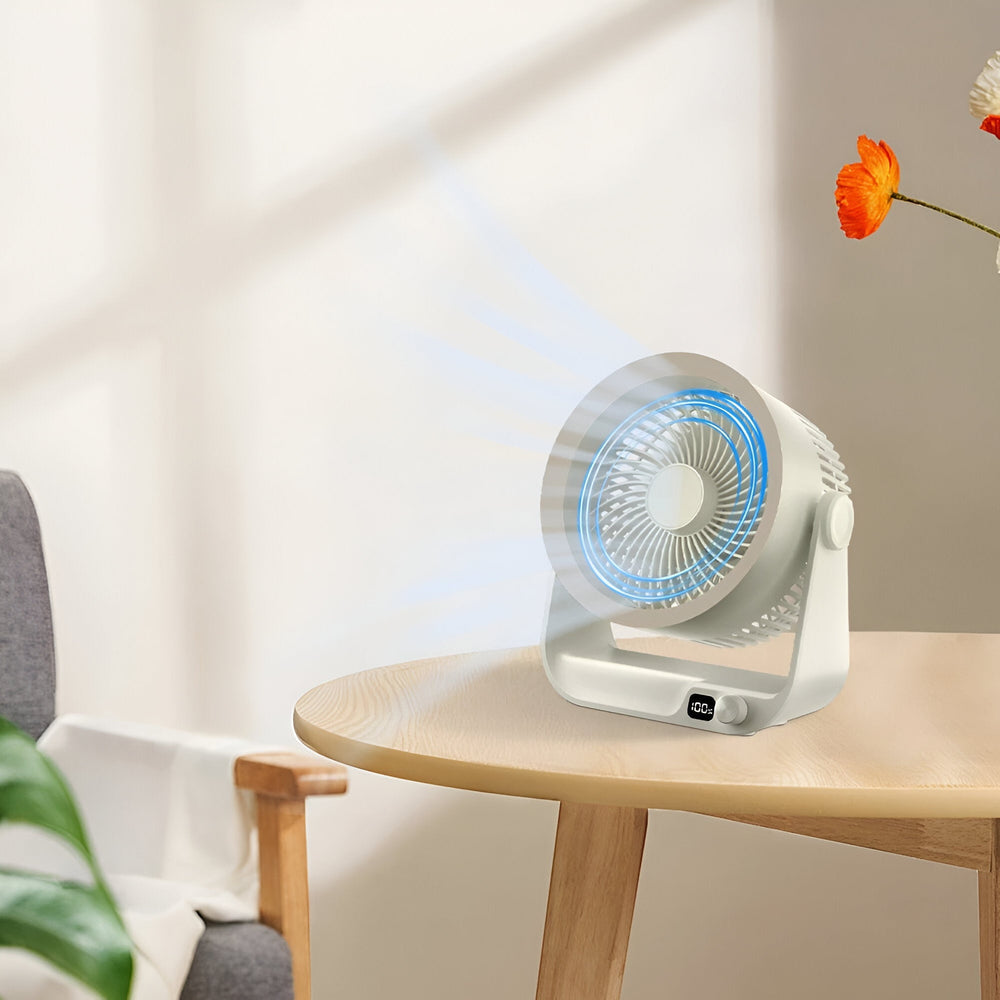Petit ventilateur de bureau oscillant silencieux, parfait pour une brise fraîche au travail.