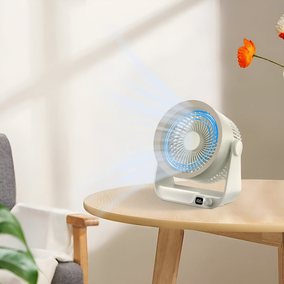 Petit ventilateur de bureau oscillant silencieux, parfait pour une brise fraîche au travail.