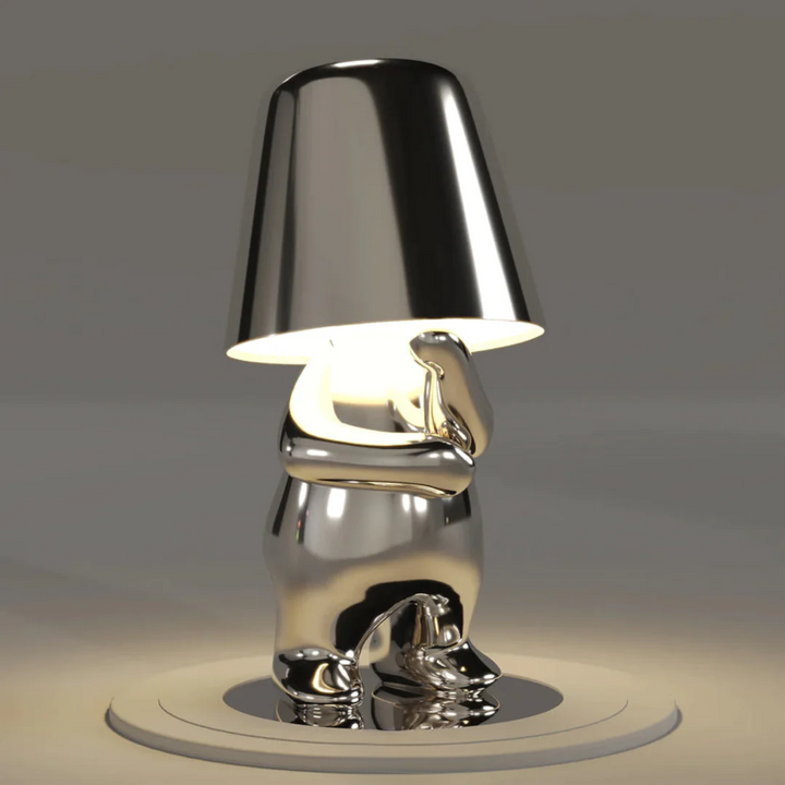 Lampe de table LumoPals, dimmable, créant une ambiance avec son éclairage ludique et son design unique.