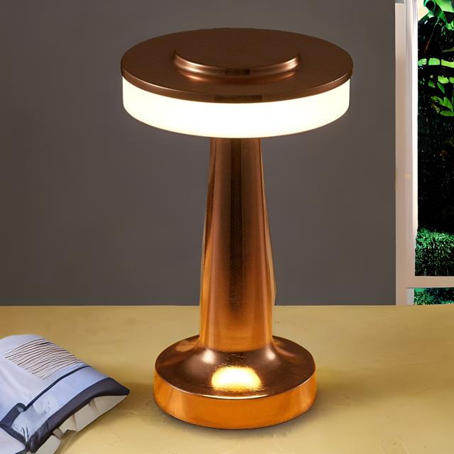 Lampe de table LED rechargeable sans fil, finition bronze. Design moderne, tactile, pour une ambiance chaleureuse.