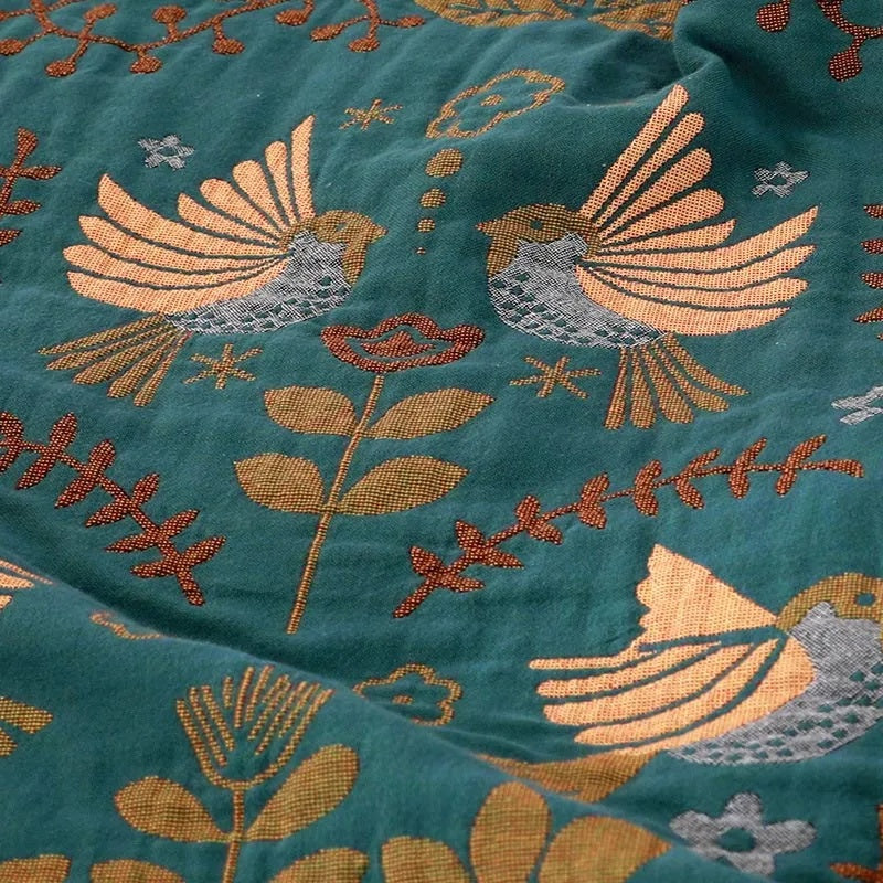 Confortable couverture en coton, réversible avec motifs d'oiseaux et de fleurs. Parfaite pour chambre, salon bohème ou scandinave.