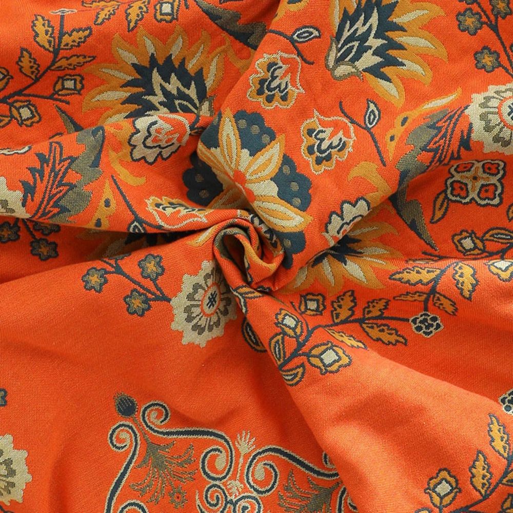 Couverture réversible en coton gaze motif floral orange et bleu sarcelle, idéale pour le lit ou comme jeté de canapé.