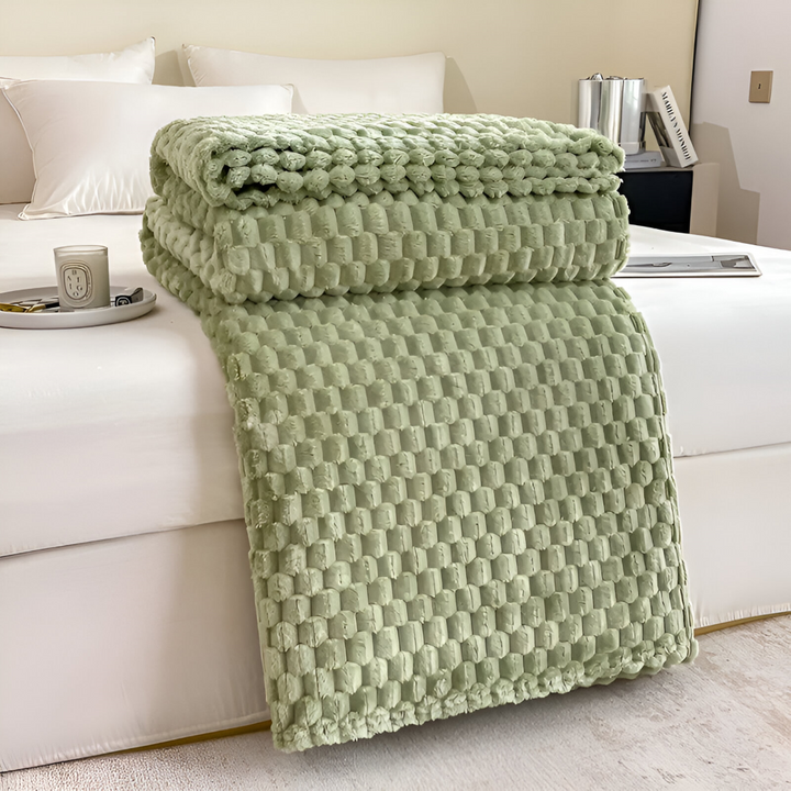 Plaid élégant en velours polyester, doux et chaud, parfait pour les soirées fraîches ou comme élément décoratif.