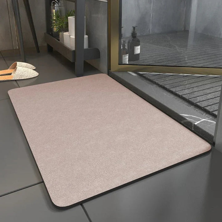 Tapis de bain ultra-absorbant pour salle de bain, offrant douceur, sécurité antidérapante et style. Linge de bain essentiel.