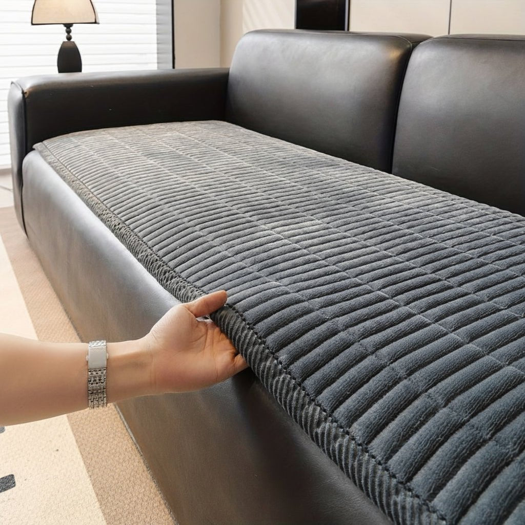 Housse de protection en microfibre matelassée offrant confort et style pour la décoration de votre salon.