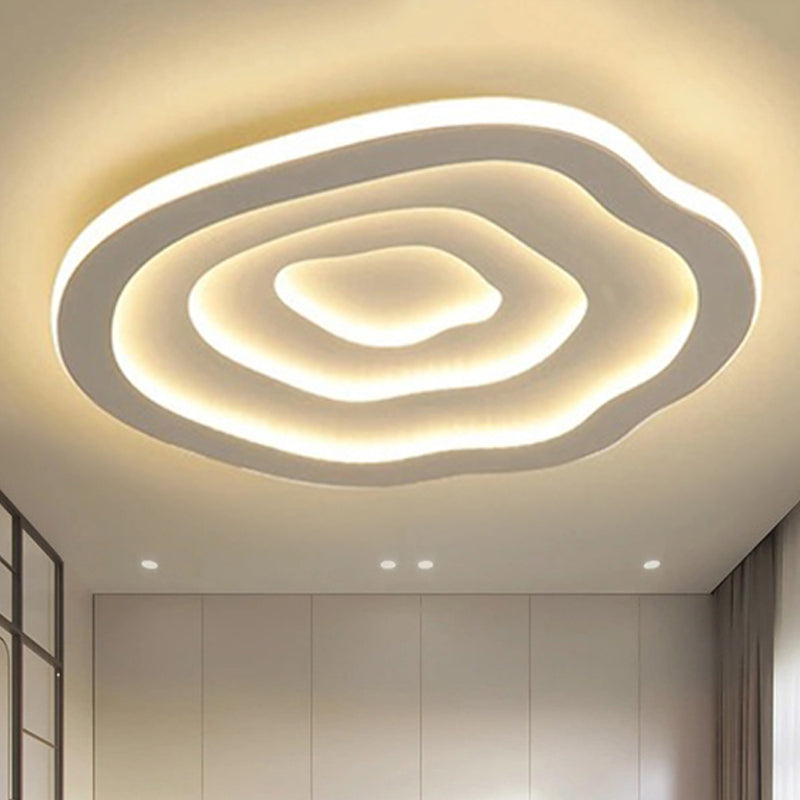 Plafonnier LED Auralis ondulé en acrylique, lumière chaude ou froide, idéal décoration maison moderne.