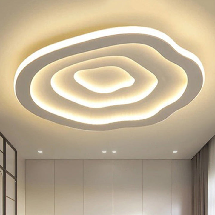 Plafonnier LED Auralis ondulé en acrylique, lumière chaude ou froide, idéal décoration maison moderne.