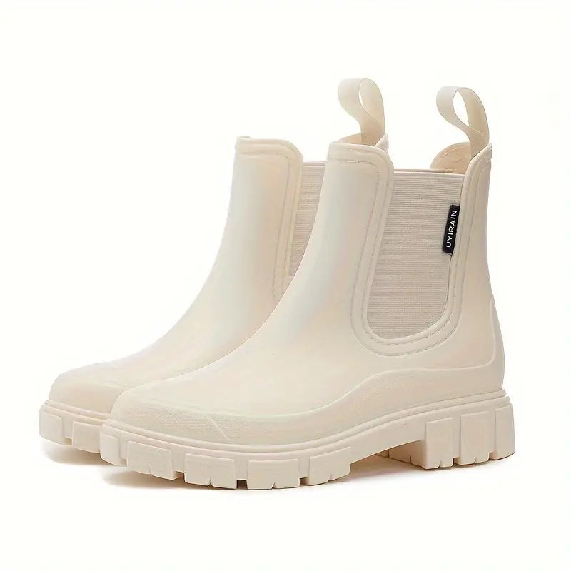 Bottes imperméables chic pour femme, idéales protection pluie automne. Semelle antidérapante confortable.