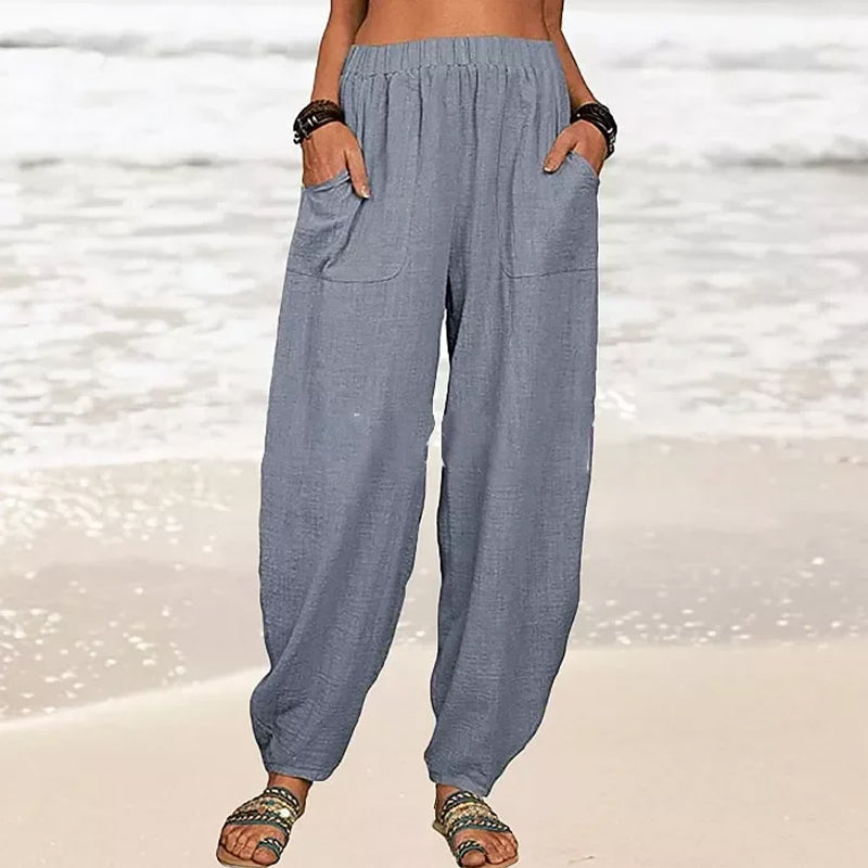 Pantalon fluide femme taille haute, coupe décontractée couleur unie, très confortable.