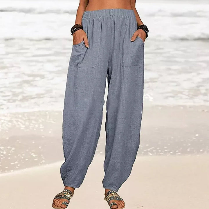 Pantalon fluide femme taille haute, coupe décontractée couleur unie, très confortable.