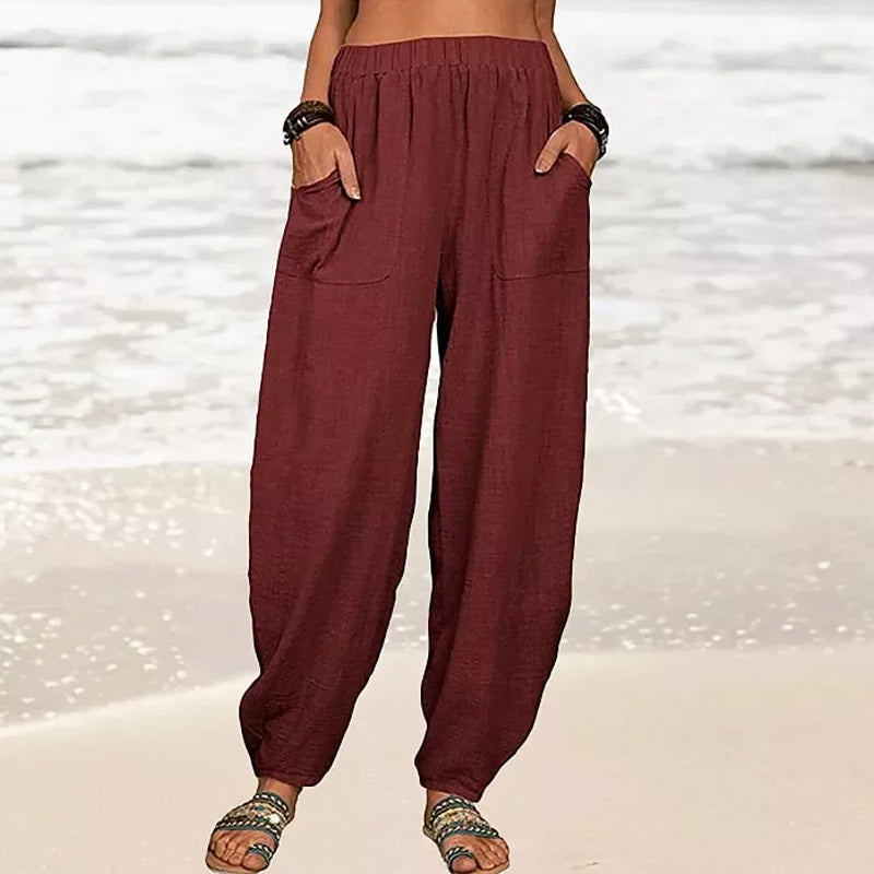 Pantalon femme fluide couleur unie, coupe harem élégante et décontractée, très confortable.