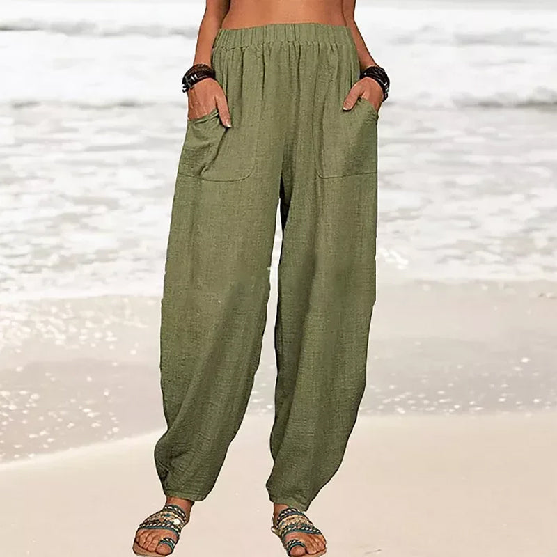 Pantalon décontracté femme, coupe harem confortable et fluide, idéal pour un look quotidien.