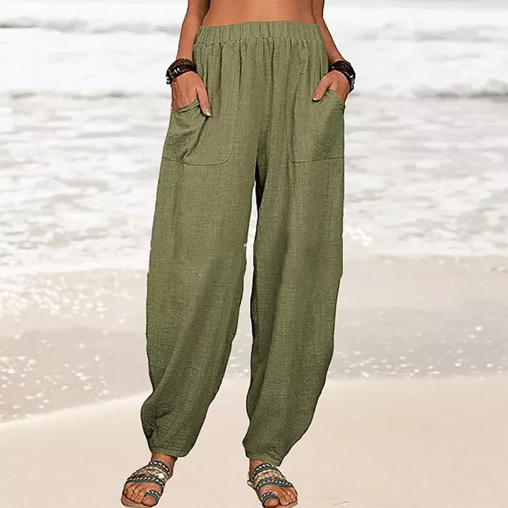 Pantalon décontracté femme, coupe harem confortable et fluide, idéal pour un look quotidien.