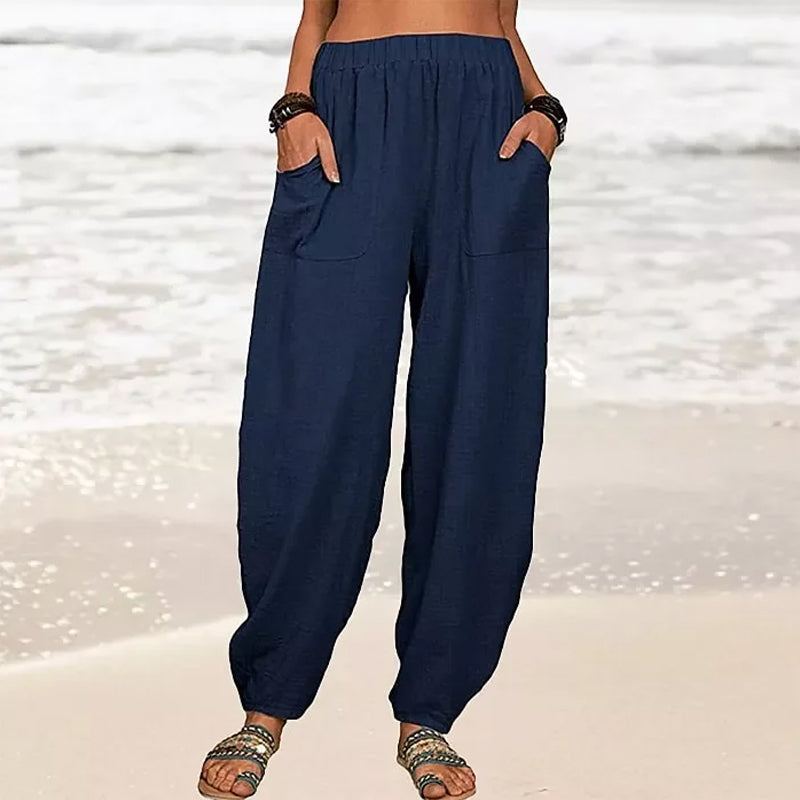 Pantalon harem femme taille haute, confortable et fluide, couleur unie pour style décontracté chic.