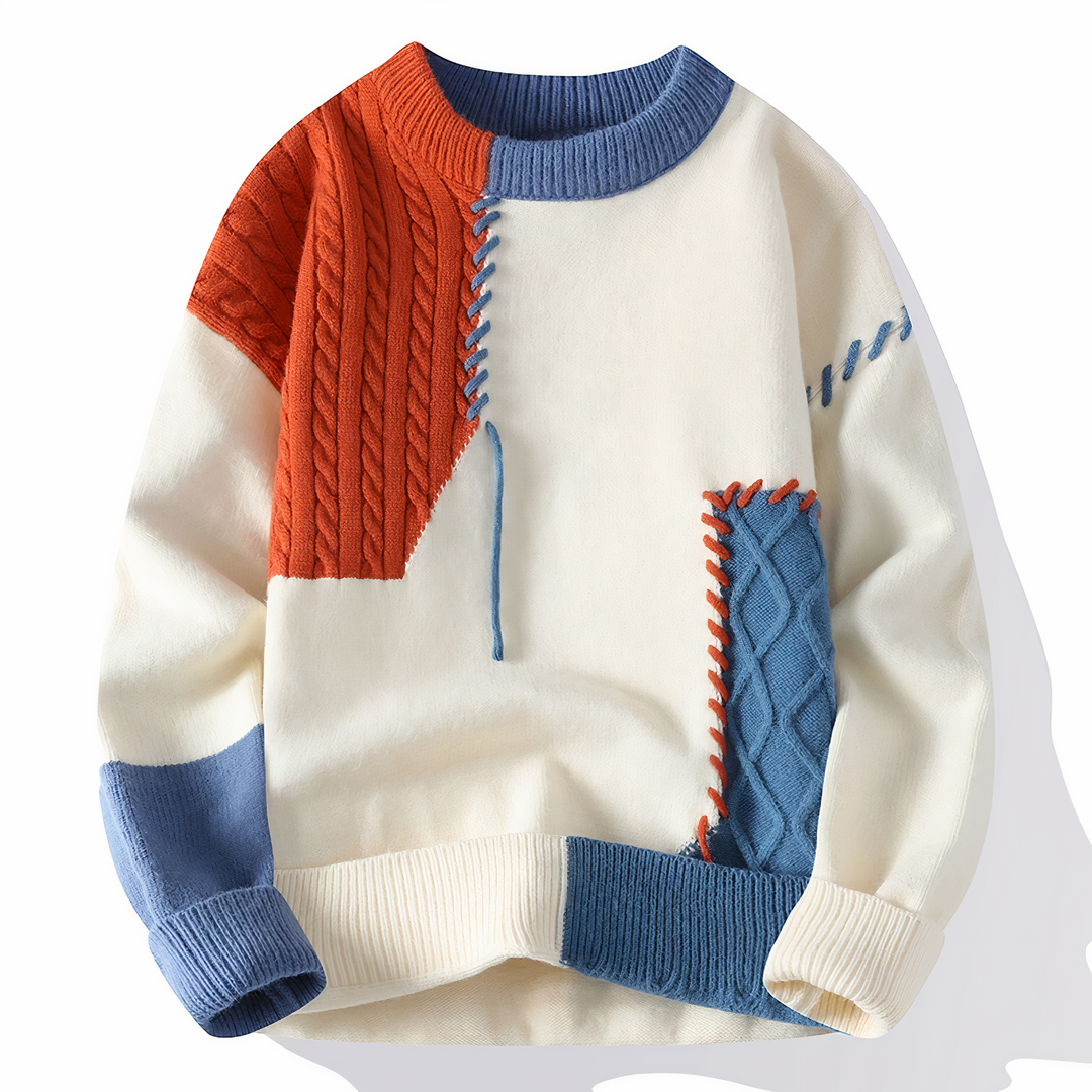 Pull patchwork homme élégant automne/hiver, mélange de couleurs unique, coupe confortable pour mode masculine.