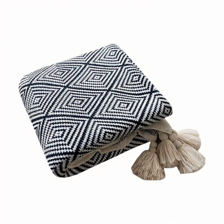 Plaid polaire décoratif noir et blanc, design géométrique minimaliste pour un style épuré et doux.