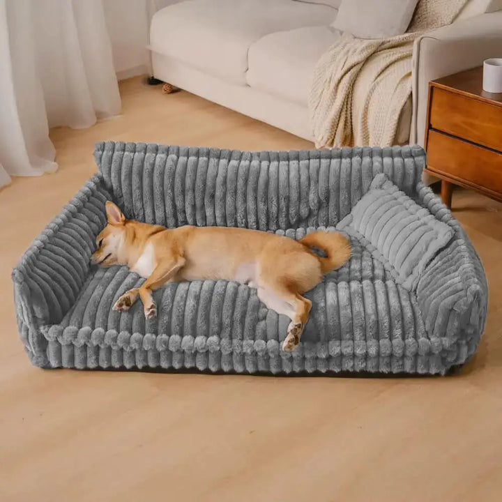 Canapé orthopédique en velours côtelé gris pour chien, offrant confort et soutien articulaire optimal.