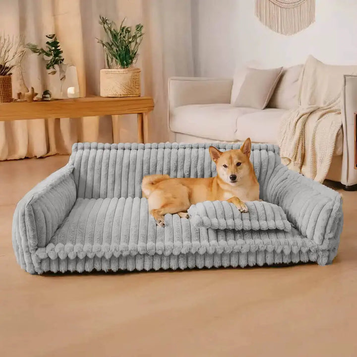 Détail du tissu en velours côtelé doux et résistant du lit pour chien, idéal pour un repos douillet.