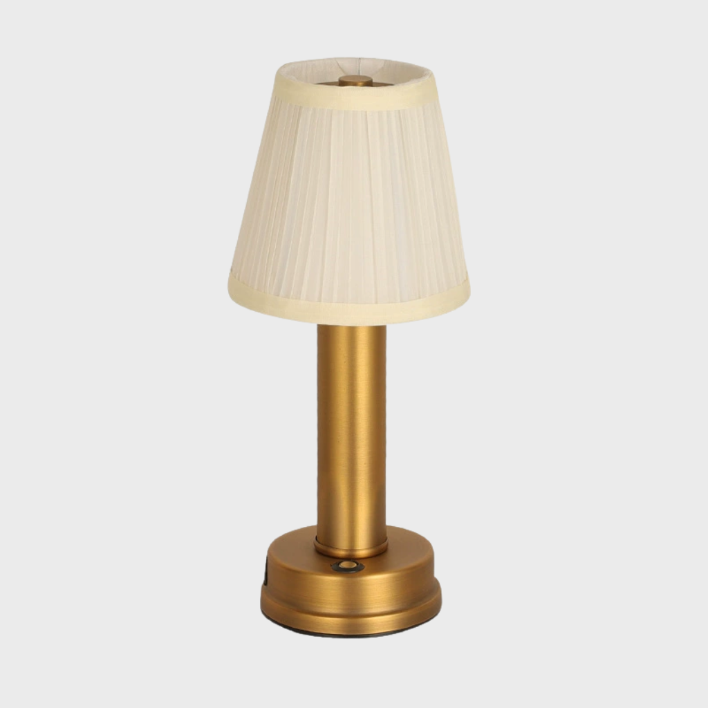 Lampe de table LED de luxe, sans fil et dimmable, fabriquée en tissu et aluminium pour un design chic et moderne.