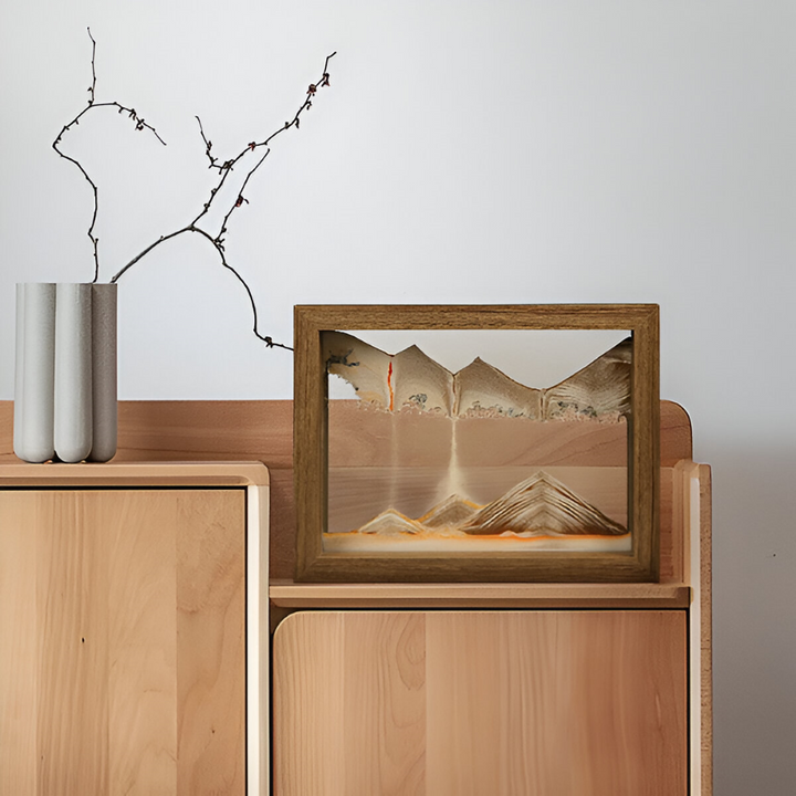 Tableau de sable cinétique rotatif pour décoration relaxante, paysage mouvant continu.