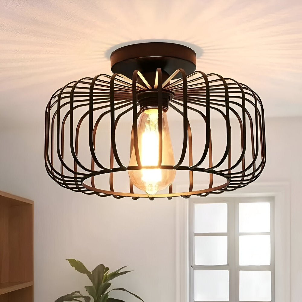 Plafonnier cage industriel noir pour salon ou chambre. Éclairage design moderne, ambiance unique.