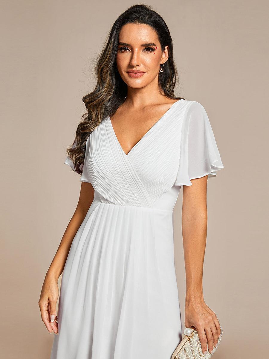 Robe femme longue fluide, col V profond, pour mariage ou soirée.