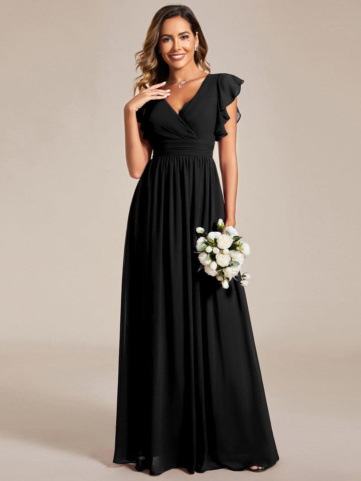 Robe de soirée chic, dos ouvert, col en V. Manches courtes, parfaite pour femme et fête.