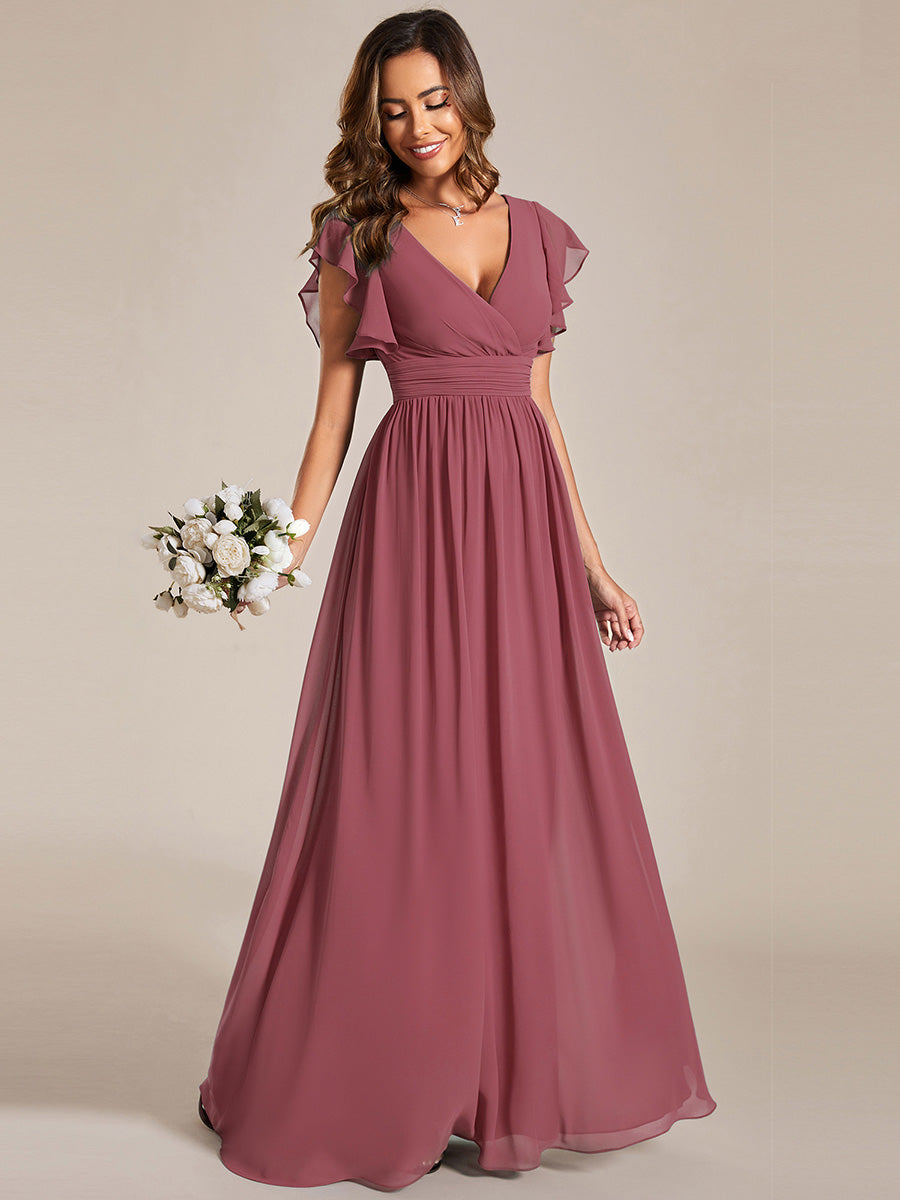 Robe longue femme, dos ouvert, col en V. Élégante pour une cérémonie ou soirée de printemps chic et lumineuse.