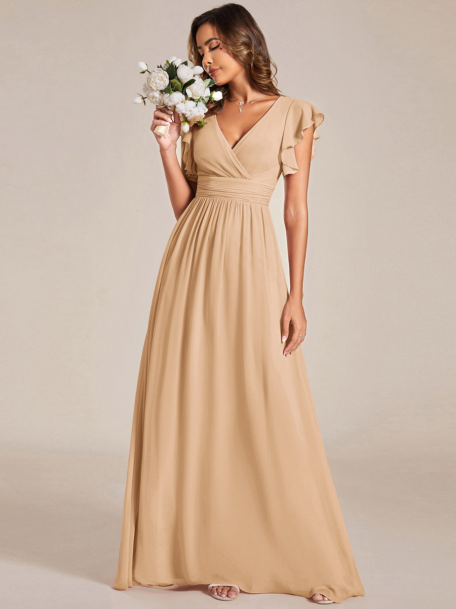 Robe de cérémonie femme, dos ouvert, col en V. Longue et fluide pour un look estival élégant.