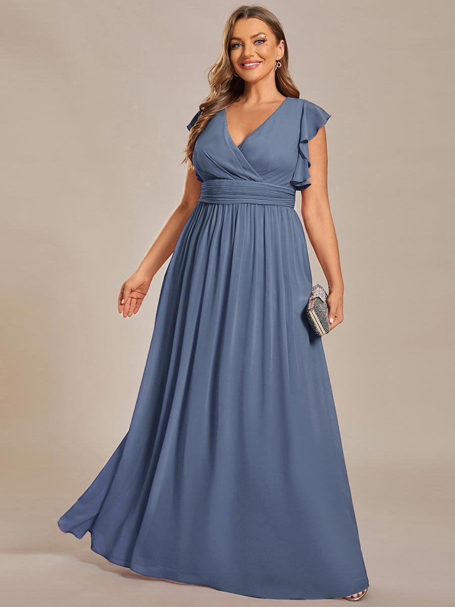 Robe de fête femme, dos ouvert, col en V. Manches courtes, fluide pour un look estival élégant.