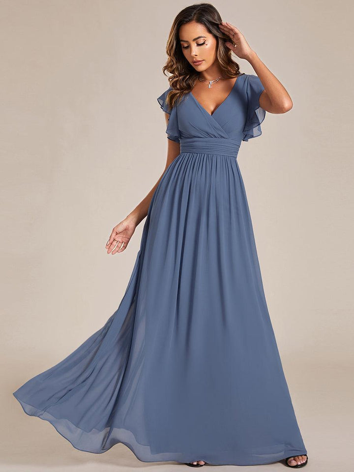 Robe de fête chic, dos ouvert, col en V, manches courtes. Parfaite pour l'été et les cérémonies.