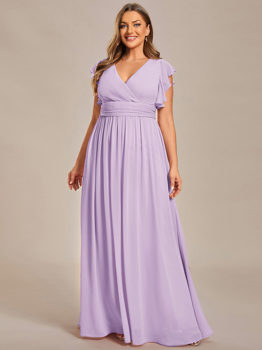 Robe de demoiselle d'honneur chic, dos ouvert, fluide. Idéale pour un mariage printanier élégant et champêtre.